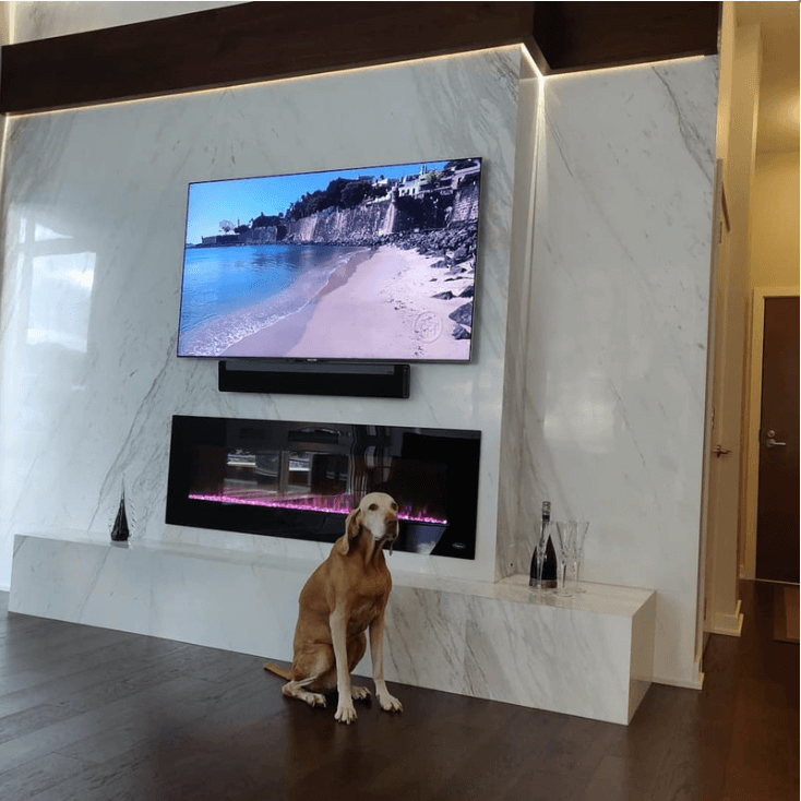 Luxury thin stone fireplace and feature wall installation in natural marble by Designer Stone Panels — project 5