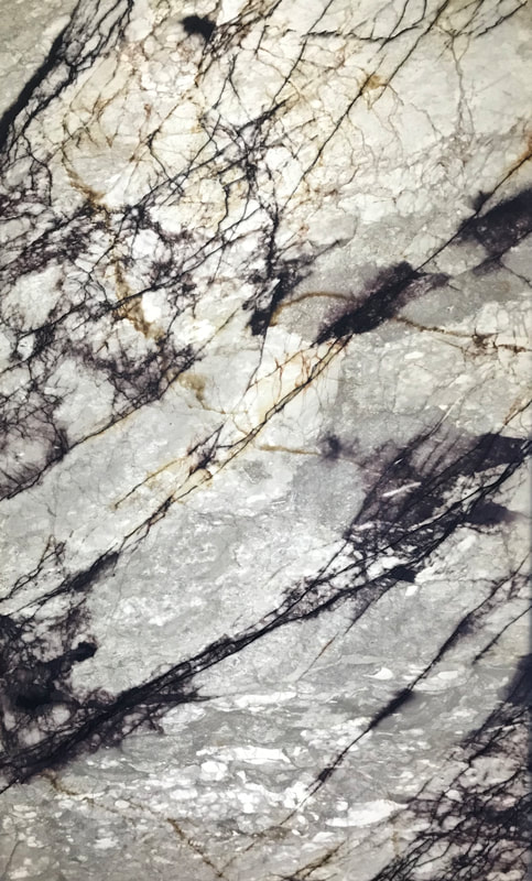 Backlit translucent Zulio marble SkinnyStone panel fireplace