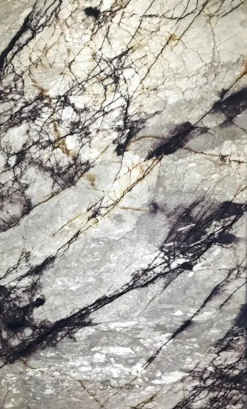 Backlit translucent Zulio marble SkinnyStone panel fireplace