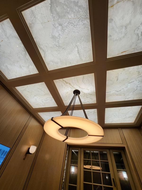 Luxury thin stone fireplace and feature wall installation in natural marble by Designer Stone Panels — project 18
