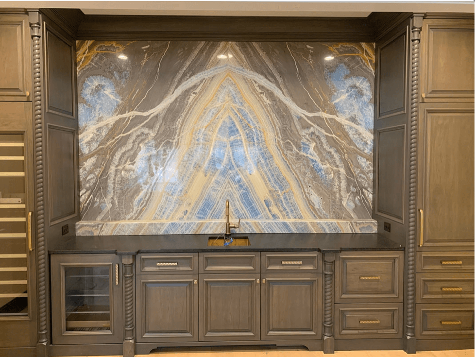 Thin natural stone kitchen backsplash with full-height bookmatched slab by Designer Stone Panels — project 6