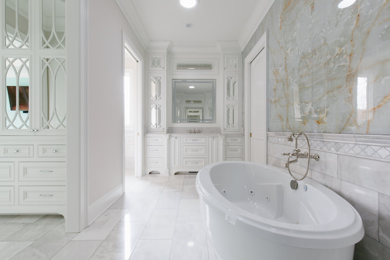 Bookmatched thin stone panel bathroom with marble walls and vanity by Designer Stone Panels — project 12