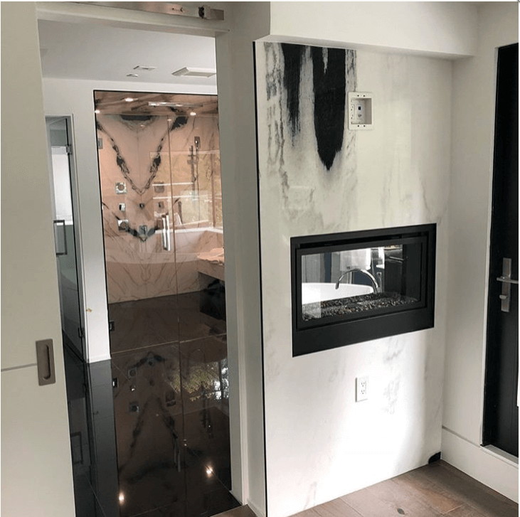Bookmatched thin stone panel bathroom with marble walls and vanity by Designer Stone Panels — project 6