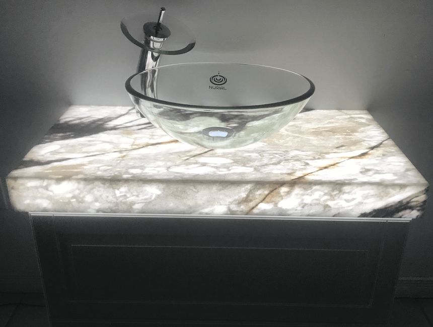 Bookmatched thin stone panel bathroom with marble walls and vanity by Designer Stone Panels — project 13