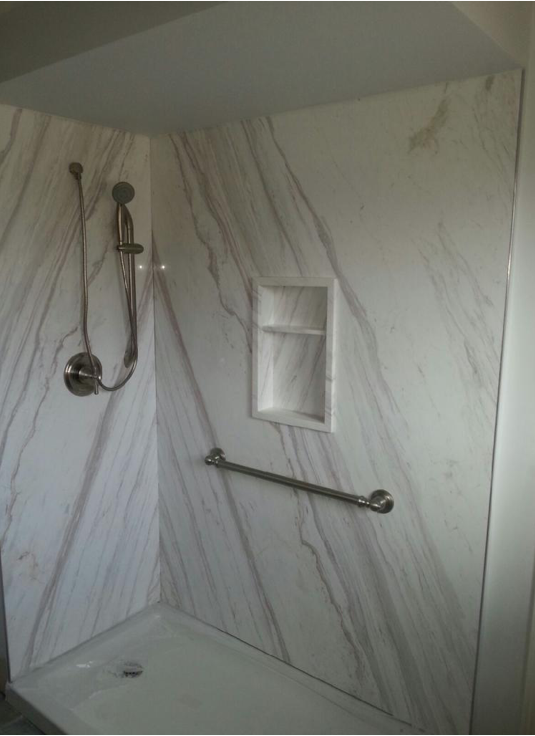 Bookmatched thin stone panel bathroom with marble walls and vanity by Designer Stone Panels — project 11