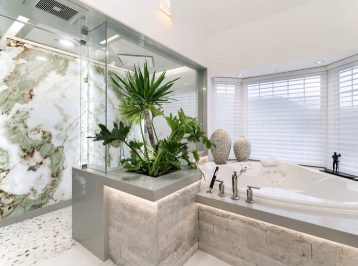 Bookmatched thin stone panel bathroom with marble walls and vanity by Designer Stone Panels — project 3