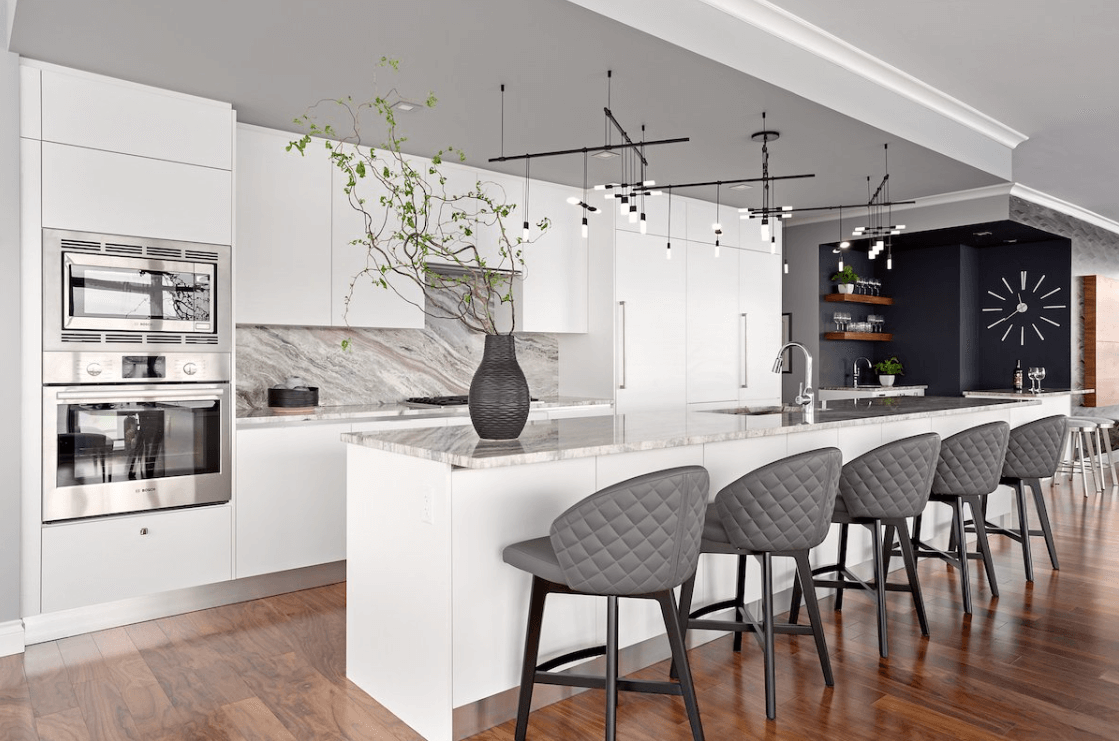 Thin natural stone kitchen backsplash with full-height bookmatched slab by Designer Stone Panels — project 1