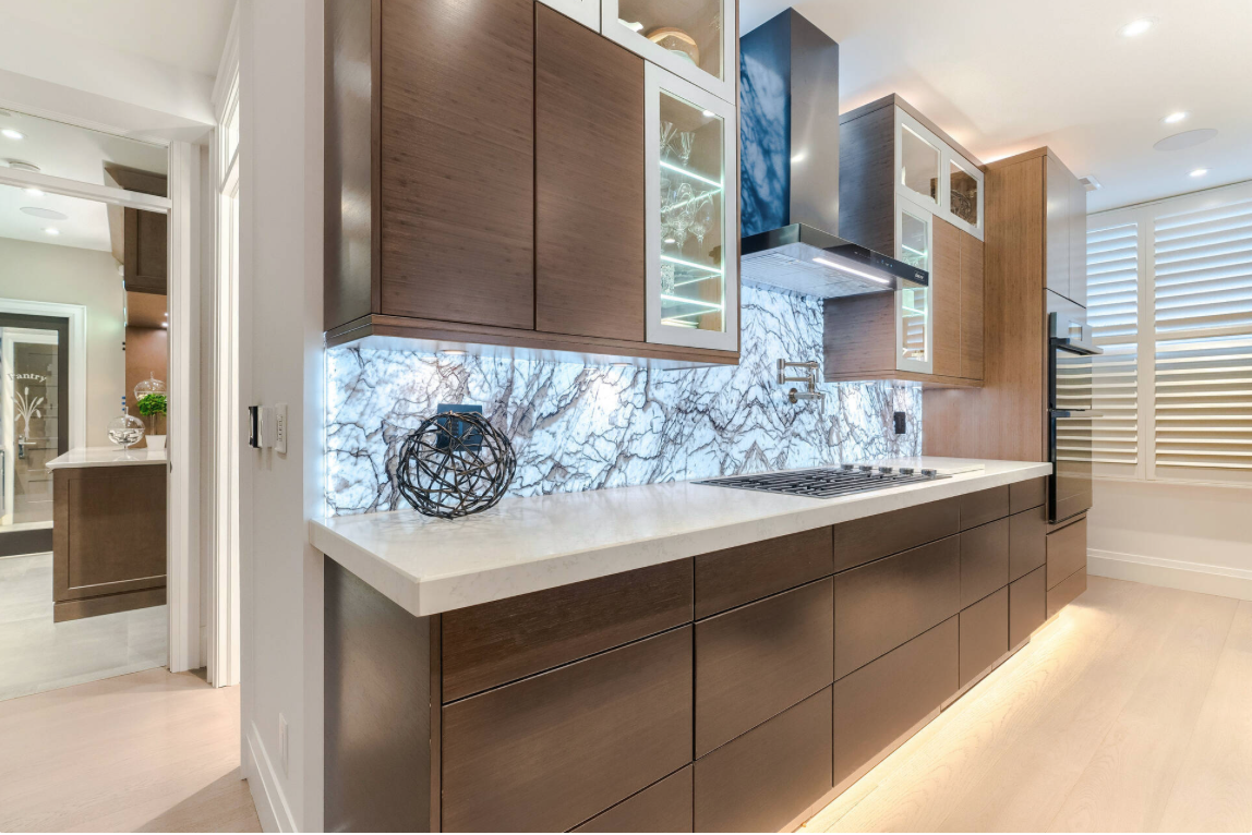 Thin natural stone kitchen backsplash with full-height bookmatched slab by Designer Stone Panels — project 2