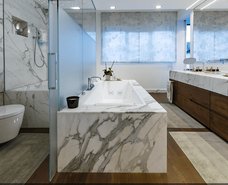 Bookmatched thin stone panel bathroom with marble walls and vanity by Designer Stone Panels — project 2