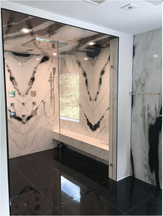Bookmatched thin stone panel bathroom with marble walls and vanity by Designer Stone Panels — project 7